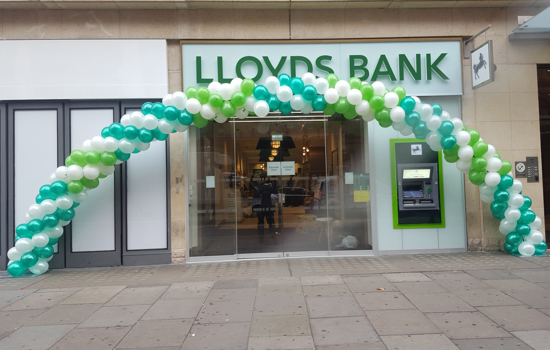 Green and White Spiral Balloon Arch created for Lloyds Bank