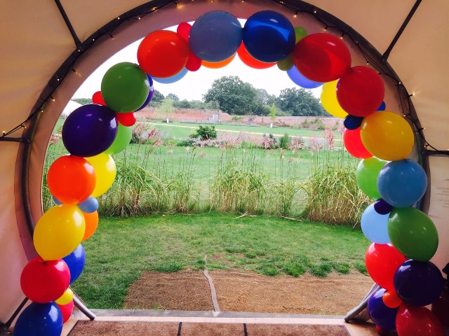 Bright Rainbow Cross Quicklink Balloon Arch at The Medicine Garden