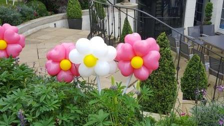 Garden decorated with small flower balloons